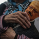 A woman holds a poster during the funeral for dissident Saudi writer Jamal Khashoggi.
